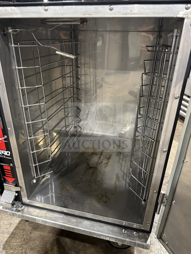 Metro Flavor Hold TC90B food warming cabinet, stainless steel interior, visible stains, wire racks, 120V, used condition.