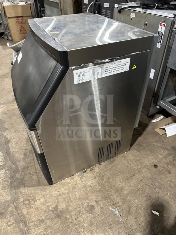 Avantco commercial stainless steel undercounter ice maker, model 194UC160HA, on legs, with visible caution label.