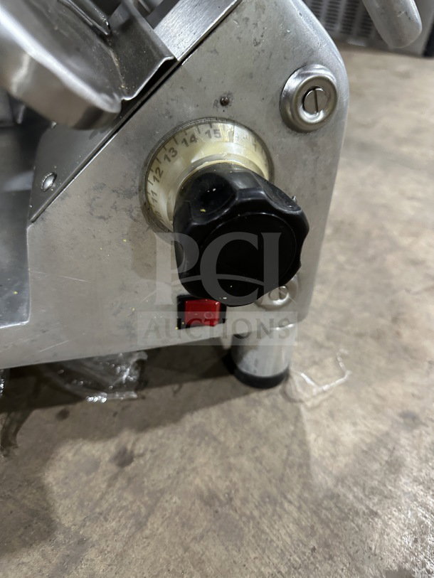 Tor-Rey R-300A electric deli meat slicer, adjustable thickness dial, power switch, stainless steel, on legs, used condition.