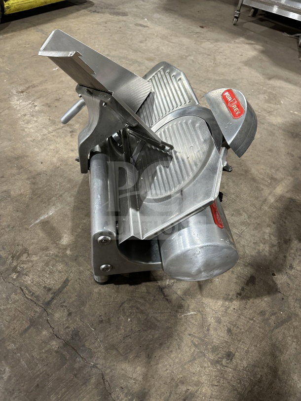 Tor-Rey R-300A electric deli meat slicer, stainless steel, countertop model, visible Tor-Rey branding, appears in used condition.