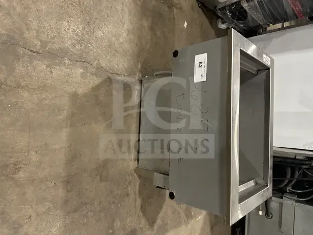 Delfield commercial stainless steel cold pan drop-in bin, Model N8118B, 115V, 1-phase, slight wear, auction tag visible.