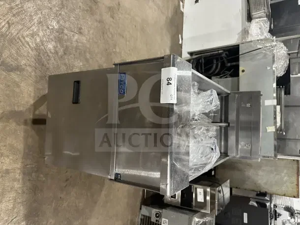 Pitco SE14T stainless steel split tank electric fryer with backsplash, basket hanger, new fry basket, individual controls, on legs.