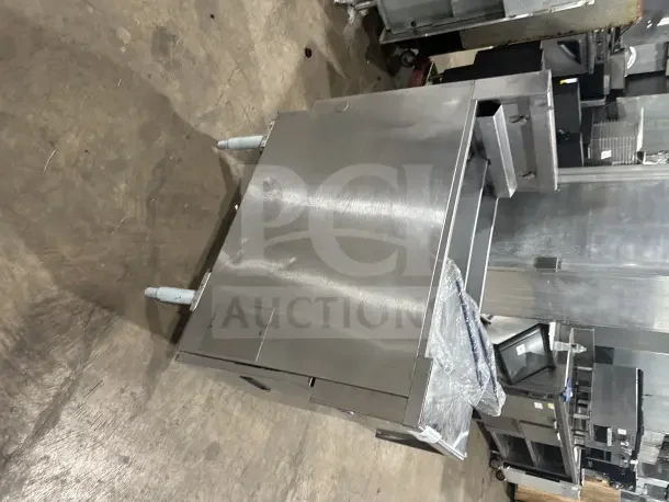 Pitco SE14T stainless steel split tank fryer with backsplash, basket hanger, and new fry basket on legs.