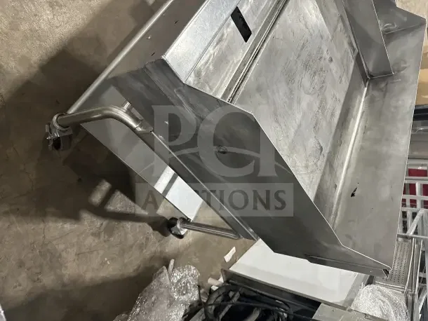 Commercial stainless steel electric griddle with split divider, back and side splashes, on mobile utility stand with casters.