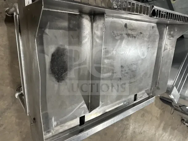 Commercial stainless steel electric countertop griddle with split divider, back and side splashes, on mobile stand with casters.