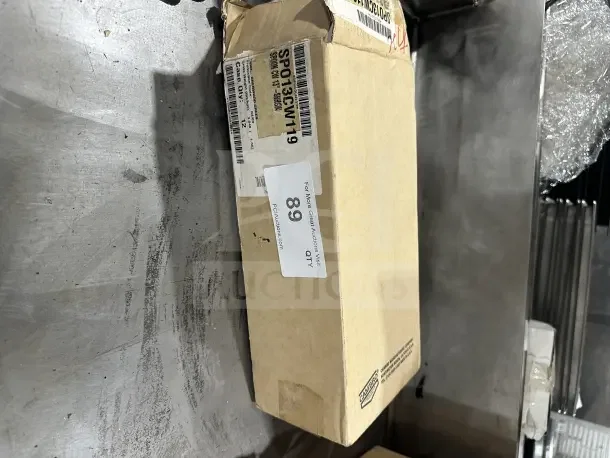 Brand new Cambro 13" green solid salad bar spoon, model SPO13CW119, in original packaging.