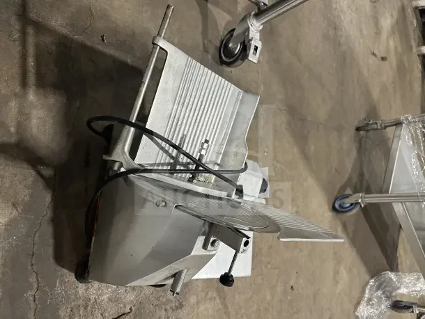 Chefmate GC12 deli meat slicer, commercial stainless steel, electric powered, countertop design, 115V, used condition.