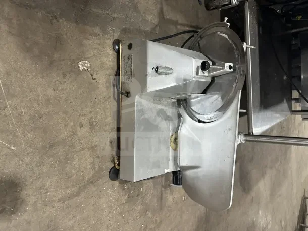 Chefmate GC12 Globe Series stainless steel deli slicer, electric, manual gravity feed, 115V, on legs, good condition.