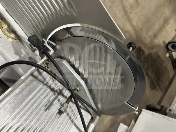 Chefmate GC12 Globe Series deli meat slicer, stainless steel, electric, gravity feed, on legs, 115V, commercial use.