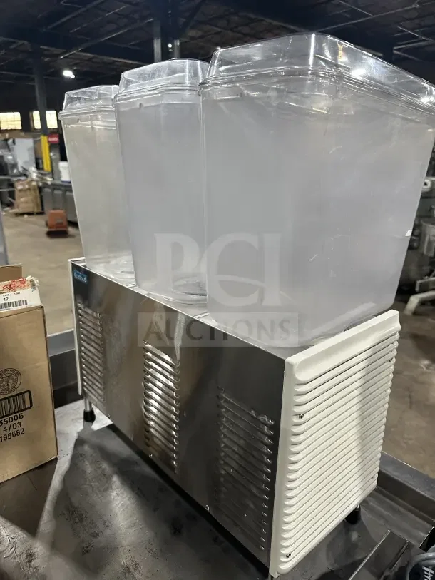 Crathco D35-4 commercial beverage machine with 3 hoppers, stainless steel finish, on legs, model D35-4 SN: TT539395, 115V.