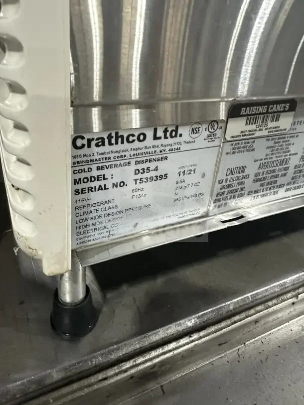 Crathco D35-4 commercial beverage machine label; Model D35-4, SN TT539395, 115V, NSF certified, on legs.