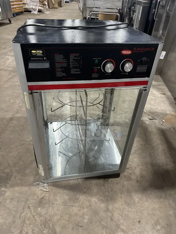Commercial 4-tier countertop heated pizza merchandiser, Hatco brand, used condition, visible control panel and temperature knobs.