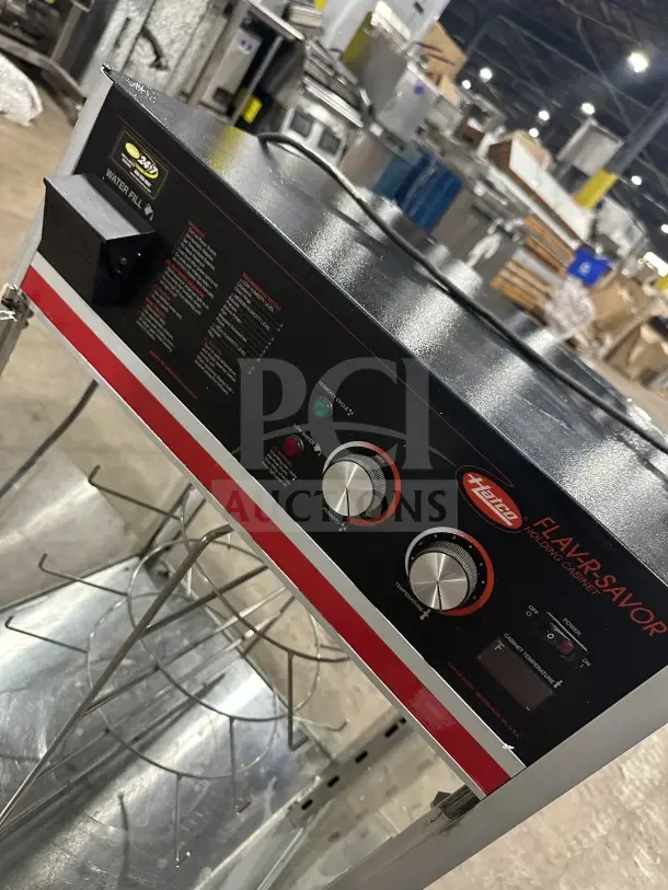 Commercial 4-tier electric heated pizza merchandiser, black finish, top control panel with knobs, in good condition.