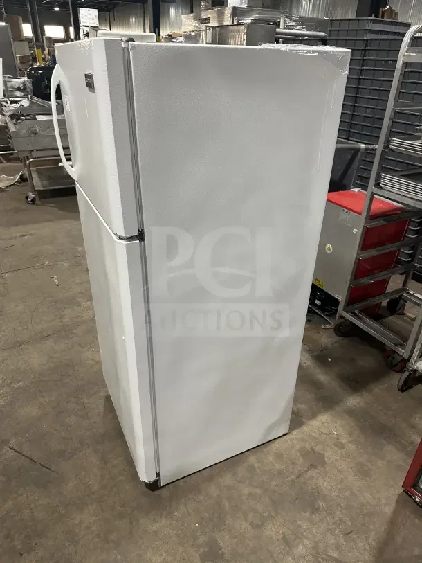 Frigidaire white top-freezer refrigerator, model FRT18G2NW9, shown in side view. Features poly-coated wired rack.