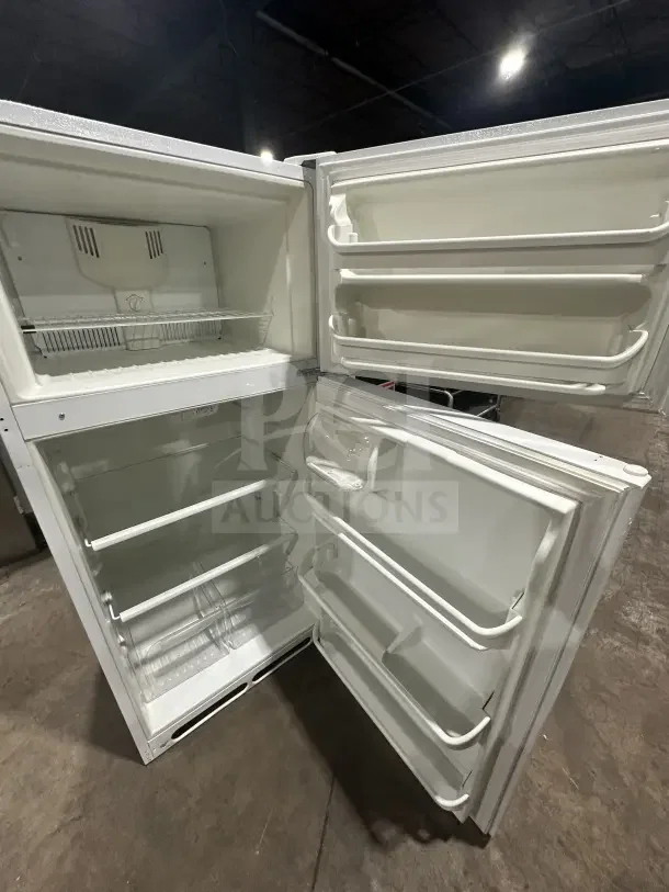 Frigidaire white top-freezer refrigerator, model FRT18G2NW9, with poly-coated wire rack, spacious interior, open doors.