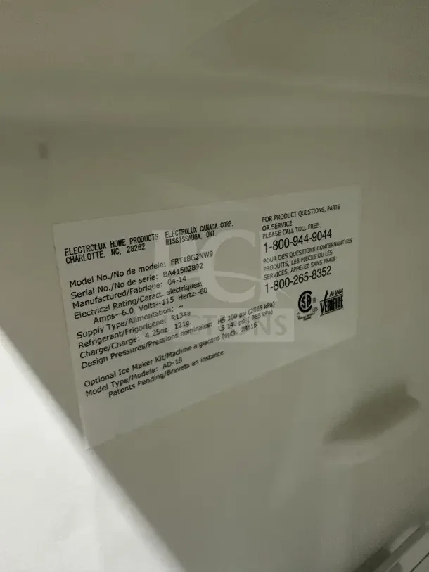 Frigidaire white top-freezer refrigerator, model FRT18G2NW9, with poly-coated wired rack, serial BA41502892.