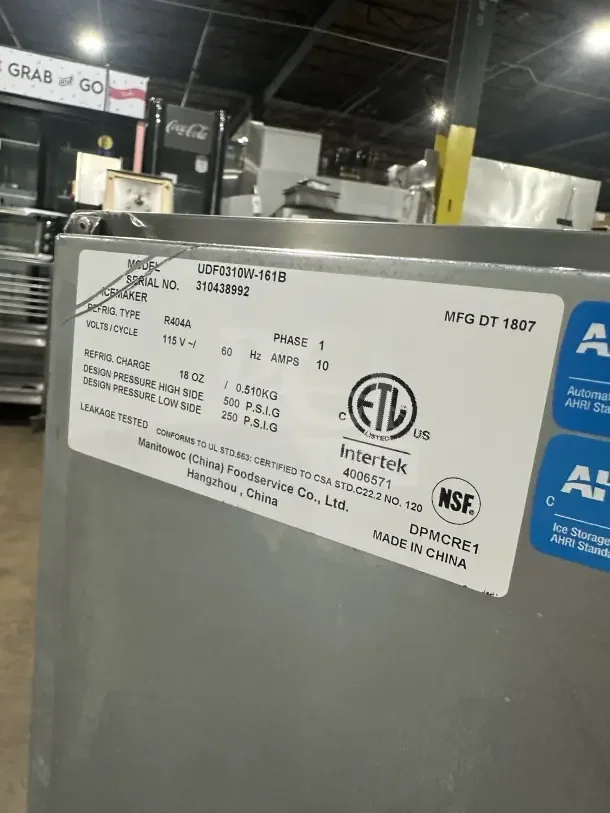Manitowoc undercounter ice machine, model UDF0310W-161B. Stainless steel, 115V, 1 phase, on legs. Serial No. 310438992.