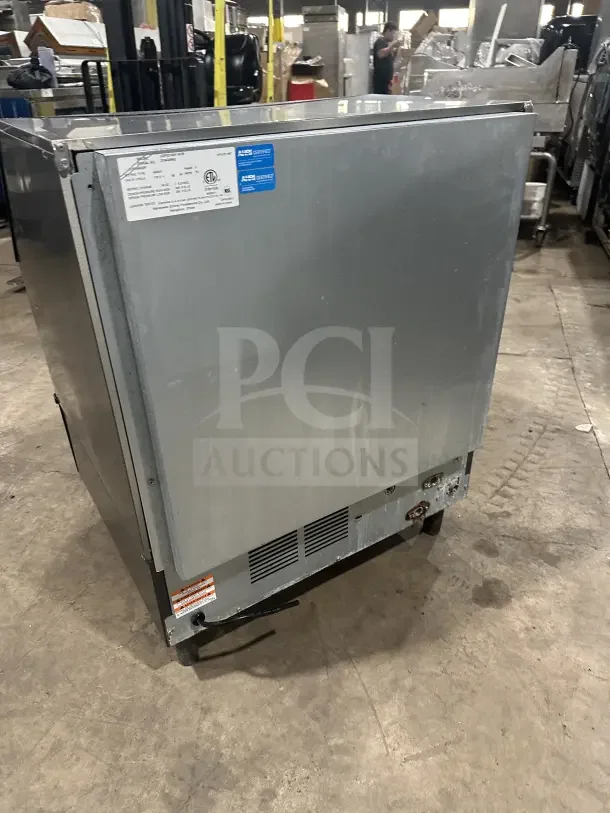 Manitowoc stainless steel undercounter ice machine, model UDF0310W-161B, on legs, 115V, 1 phase, with labels visible.