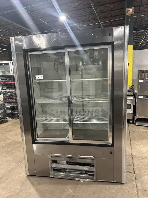 Leader LS54SC stainless steel reach-in refrigerator merchandiser with rear sliding glass doors and poly-coated rack.