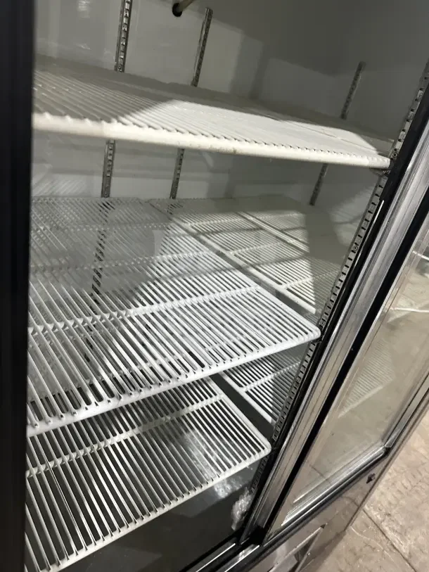Leader LS54SC commercial stainless steel refrigerator, rear sliding glass doors, poly-coated racks, excellent condition.