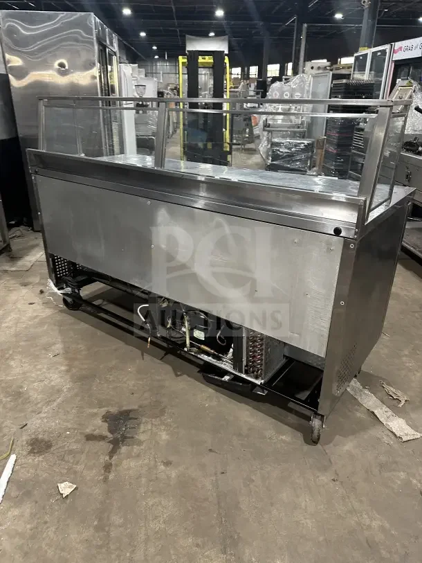 True TWT-72 commercial stainless steel 3-door worktop refrigerator. Energy Star certified, with upturned backsplash, poly-coated rack, on casters. Model SN: 7384268.