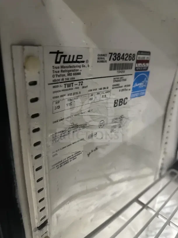 True TWT-72 refrigerator label and wire rack. Model TWT-72, SN: 7384268, Energy Star certified, 115V, on casters.