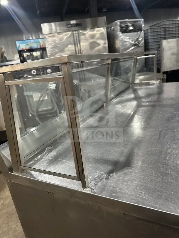 True TWT72, 72" stainless steel worktop refrigerator, Energy Star, three-door, uptown backsplash, poly-coated rack, on casters.