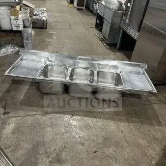 Commercial stainless steel 3-compartment sink with two side drainboards and supporting legs. Great condition.