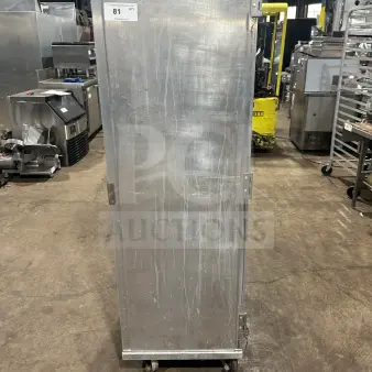 Commercial stainless steel single section heated holding/proofer cabinet on casters, industrial setting, item tag "81".