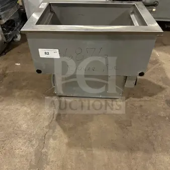 Delfield commercial stainless steel cold pan drop-in bin, Model N8118B, 115V, 1-phase, slight wear, auction tag visible.