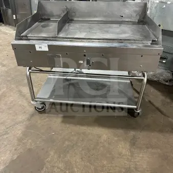 Commercial stainless steel countertop griddle with split divider, back and side splashes, on mobile stand with casters.