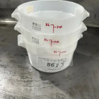Commercial 2Qt polypropylene food containers, translucent white, stackable, new condition, marked 2L/2qt.