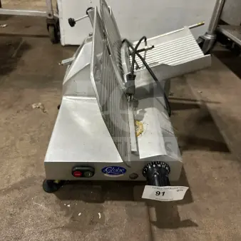 Chefmate GC12 commercial deli meat slicer, stainless steel, electric, gravity feed, Globe Series, manual controls, SN: 302283.