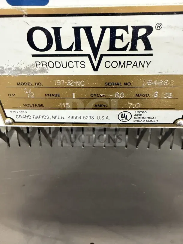 Oliver Model 79732NC bread slicer machine tag, 115V, 1 Phase, Serial 164680, with UL certification and stainless steel worktop.