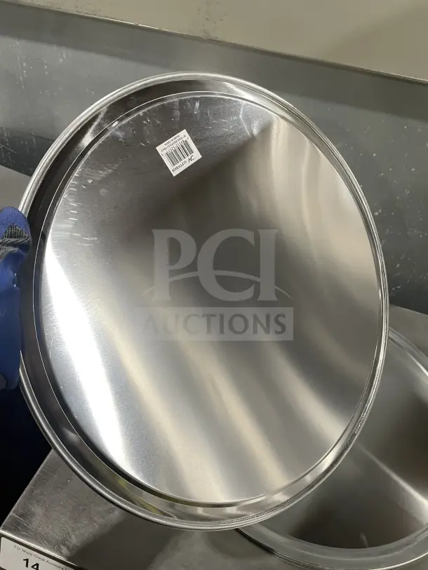 Thunder Group ALPTWR018 stainless steel pizza tray, commercial grade, with barcode label. New condition, shiny finish.