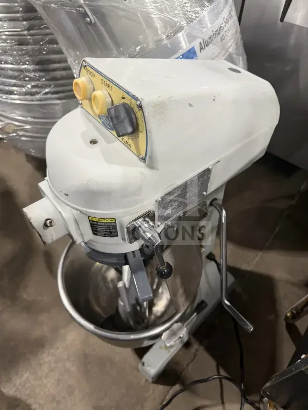 Globe white commercial electric 20 Qt. planetary stand mixer with stainless steel bowl, visible control panel, used condition.