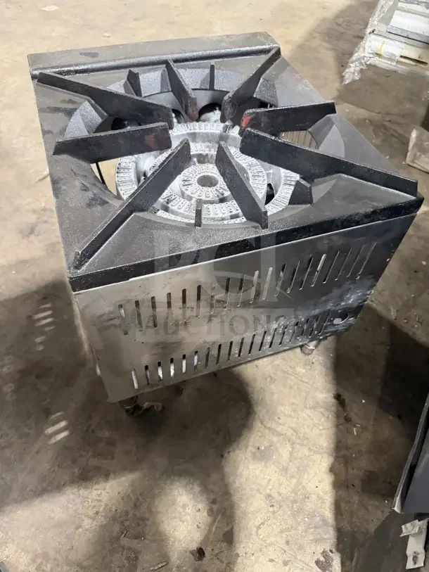 Commercial stainless steel countertop single burner gas range on legs. Features durable construction and heavy-duty grate.