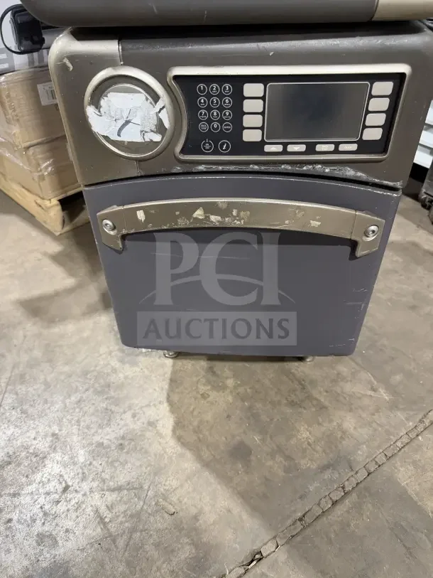 TurboChef NGO commercial rapid cook oven with digital push controls, model NGOD11039, on legs, showing signs of wear.