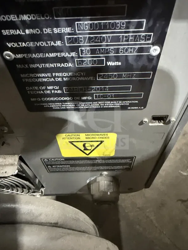 TurboChef NGO commercial oven label showing model and serial number NGOD11039, with voltage and safety warnings.