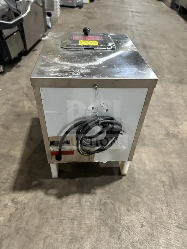 Clawson PC-2000 stainless steel countertop cube ice crusher, 115V, 1 phase, with legs. Minor surface wear visible.