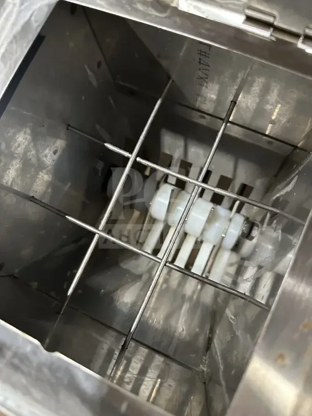 Clawson PC-2000 stainless steel electric cube ice crusher, countertop model, 115V, 1 phase, on legs, viewed from above.