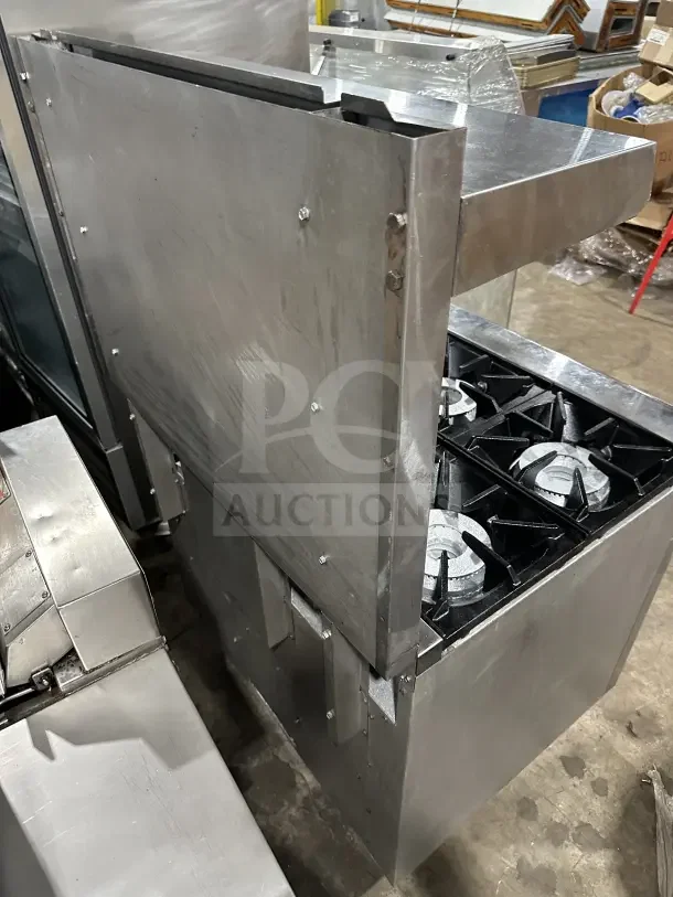 Pantin stainless steel natural gas 6-burner range with oven, wired rack, and backsplash. Visible wear, suitable for commercial use.