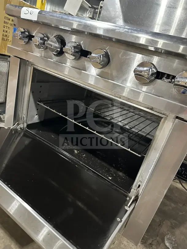 Pantin stainless steel 6-burner natural gas range with oven, wired rack, and backsplash. Five control knobs. Used condition.