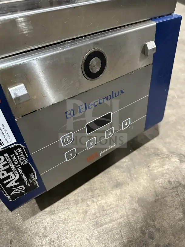 Electrolux HSPPA1 stainless steel countertop sandwich press grill, 208V, 1 Phase, on legs, with digital controls.
