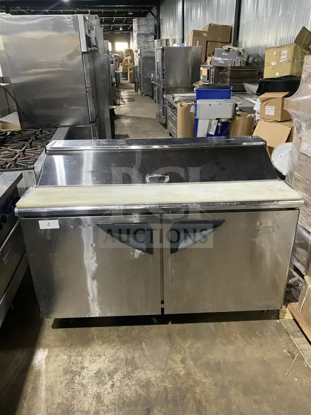 Turbo Air TST-60SD stainless steel 2-door refrigerated prep table with cutting board, chrome rack, on casters. Model SN: S616508011.
