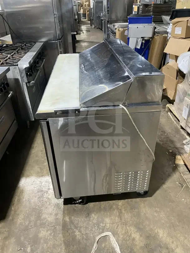 Turbo Air TST-60SD stainless steel 2-door refrigerated prep table with cutting board, chrome rack, on casters, 115V.