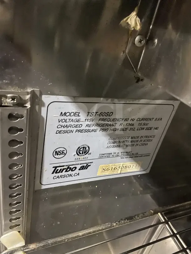 Turbo Air TST-60SD label, 115V, stainless steel, with model and serial numbers, NSF and ETL logos, and manufacturing details.
