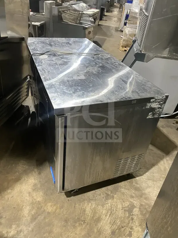 Turbo Air MUF60 stainless steel 60" undercounter freezer with 2 doors, poly-coated rack, and casters. Model MUF-60, 115V.