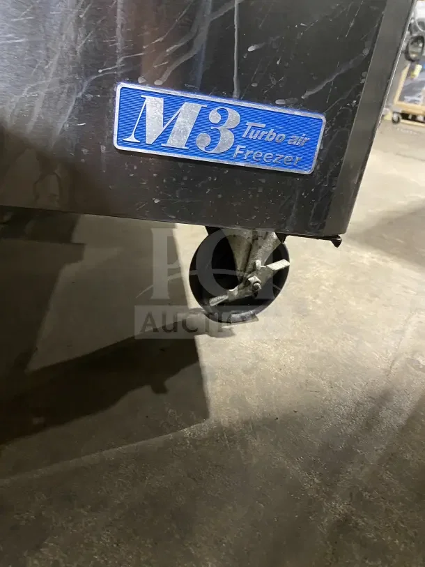 Turbo Air MUF60 60" stainless steel undercounter freezer with casters, poly-coated wired rack, and M3 Turbo Air Freezer label.