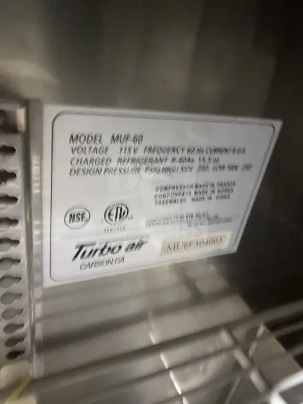 Turbo Air MUF-60 undercounter freezer label, model MU8F364663, 115V, NSF and ETL certified, serial label visible.